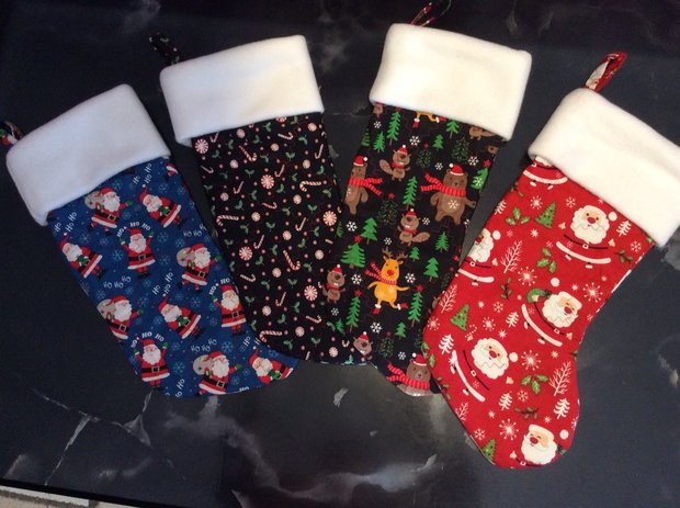 Christmas Stockings by 
Della Cronkrite