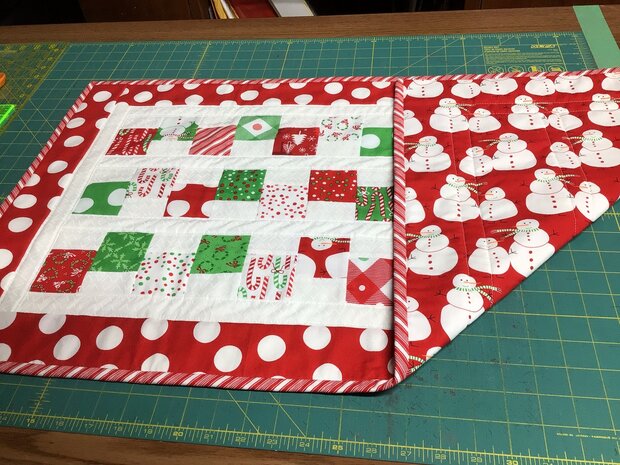 Red Snowman Runner by 
Della Cronkrite