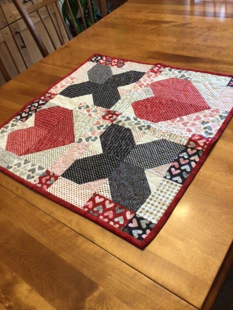Hearts and Kisses Wallhanging by 
Della Cronkrite