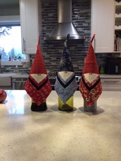Santa Wine Bottle Covers by 
Della Cronkrite