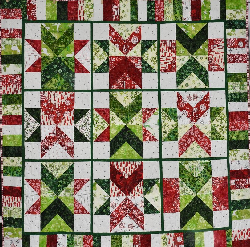 Festive Wishes Batik Lap Quilt by 
Della Cronkrite