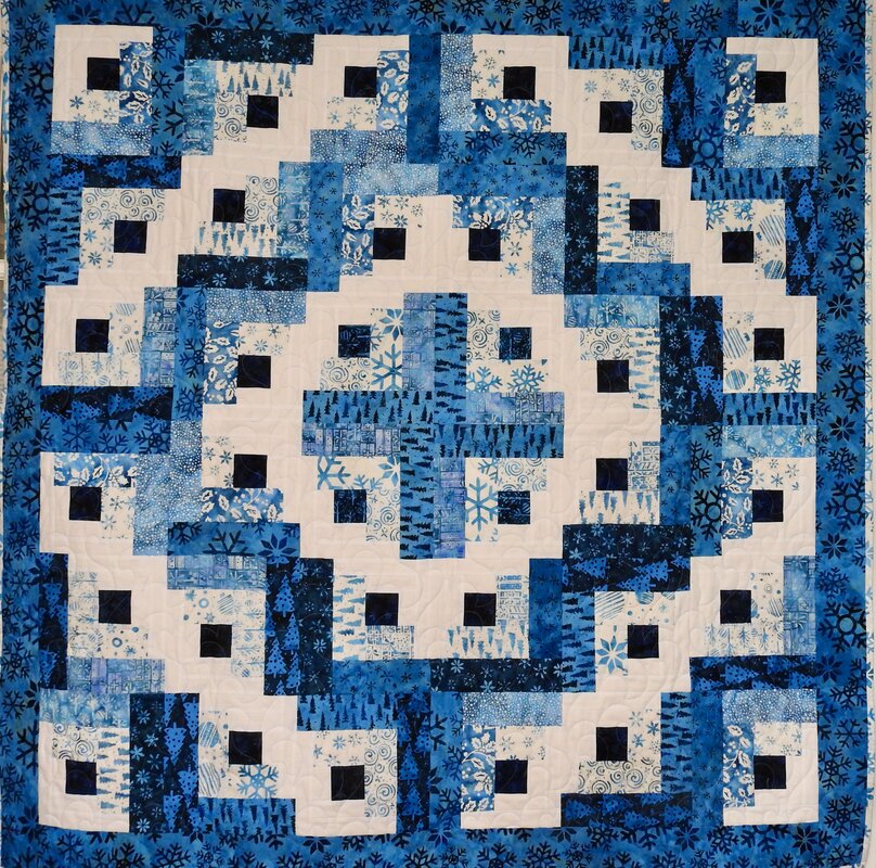 Snowfall Batiks Log Cabin Quilt by 
Della Cronkrite